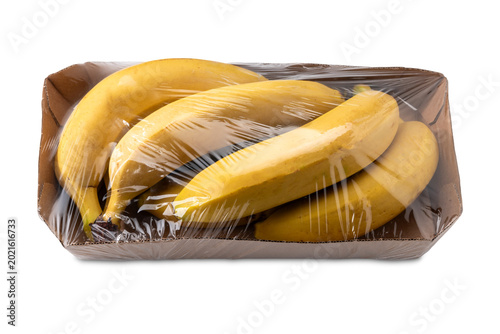 Quadro su tela Fresh Cavendish bananas packaged in acardboard tray lined with clear plastic wra