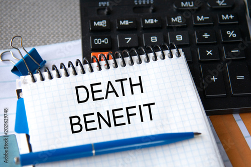 Tableau sur toile Notebook with the words DEATH BENEFIT in the notebook on the background of a bla