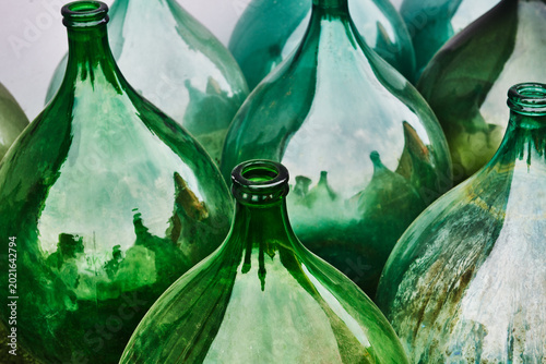 Vintage Italian demijohns, large glass bottles typically used for wine making.