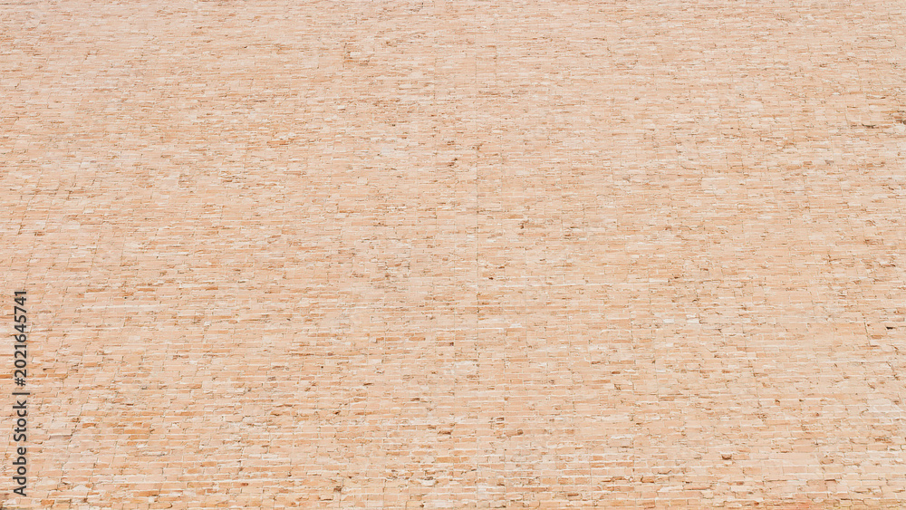 Fototapeta premium Pink brick texture background with repeating pattern