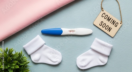Baby announcement with socks and thermometer.