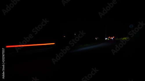 Close-up abstract photo of blurred moving light objects captured with slow shutter speed technique. Soft glowing light trails create an artistic background with dynamic motion, dreamy atmosphere, and 