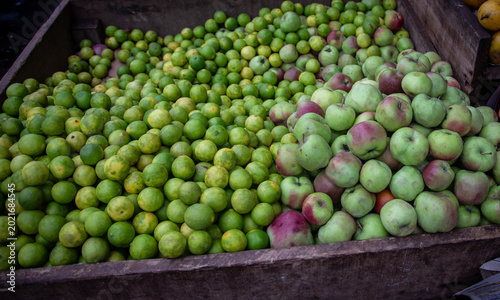 display of limes  and Peruvian apples (manzanas) at a market