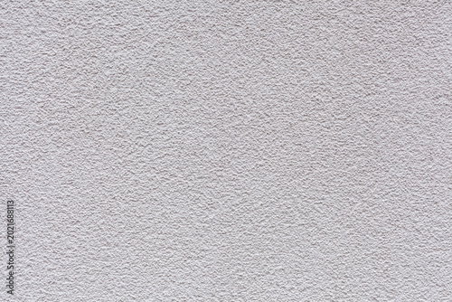 Bild auf Leinwand A close-up sample of decorative plaster coating on the walls of a house with a s
