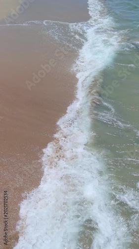 Summer seascape beautiful waves, blue sea water in sunny day. Royalty high-quality free best stock of tranquil beach with turquoise waves splashing, sand shore. Aerial view, tropical nature background