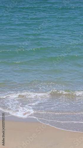 Summer seascape beautiful waves, blue sea water in sunny day. Royalty high-quality free best stock of tranquil beach with turquoise waves splashing, sand shore. Aerial view, tropical nature background