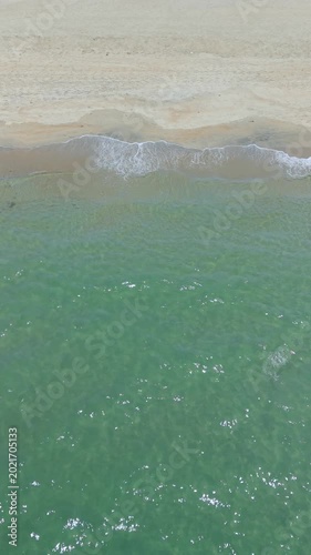 Summer seascape beautiful waves, blue sea water in sunny day. Royalty high-quality free best stock of tranquil beach with turquoise waves splashing, sand shore. Aerial view, tropical nature background