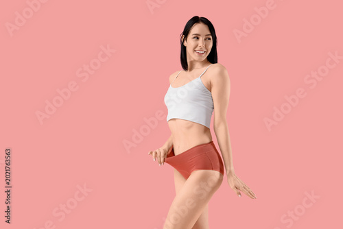 Young woman in red menstrua...