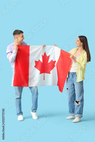 Young couple with flag of C...