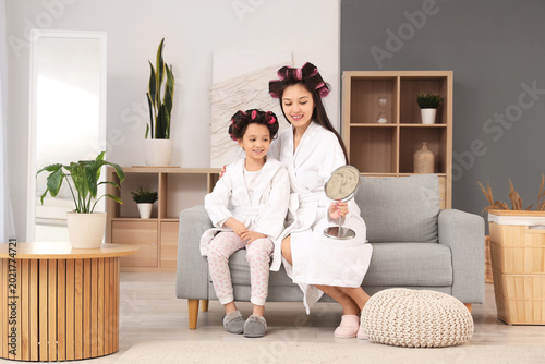 Little Asian girl and her m...