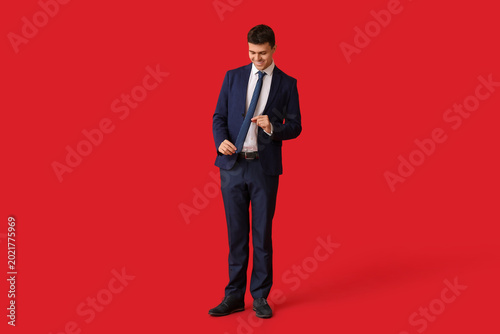 Smiling young man with styl...