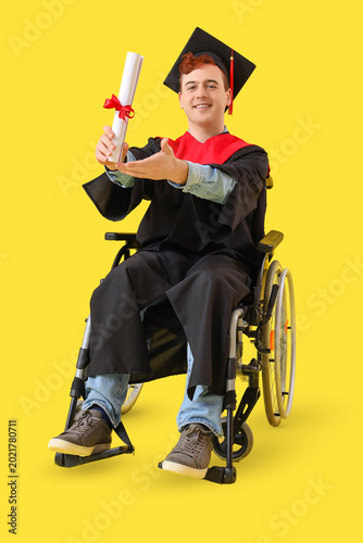 Male graduate in wheelchair...