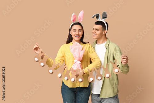 Happy young couple with Eas...