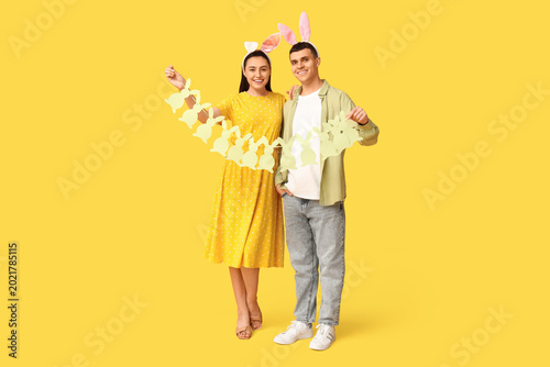 Happy young couple with Eas...