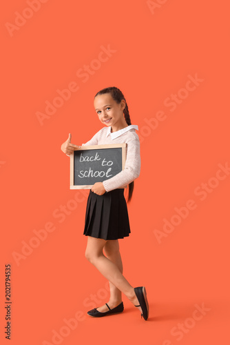 Little schoolgirl in stylis...