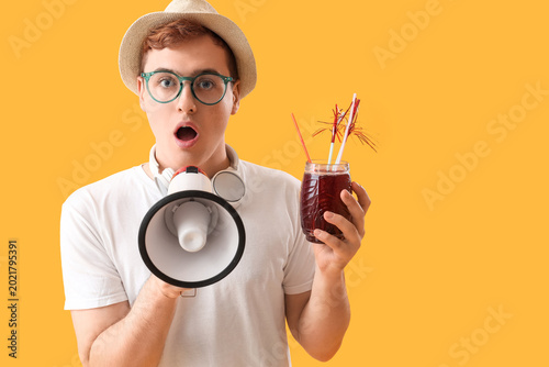 Young man with glass of jui...