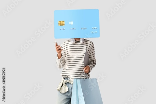 Young man with credit card ...