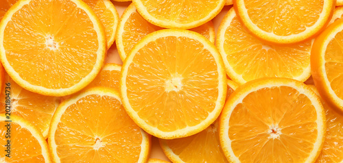Принти на полотні Pieces of fresh oranges as background