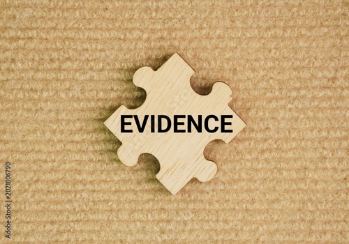 Wooden puzzle with the word evidence. any factual information, object, sign, or testimony that supports a claim, proves a point, or makes a truth apparent