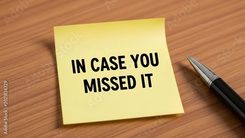 Yellow sticky note with reminder text.