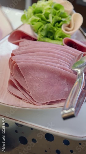 Fresh Sliced Deli Meat and Lettuce on a Buffet Plate
