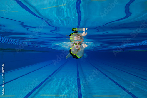 Underwater Photo of Young Female Athlete Swimming in Pool