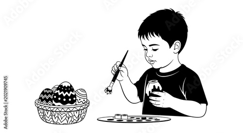 Little boy painting decorative Easter eggs for holiday celebration