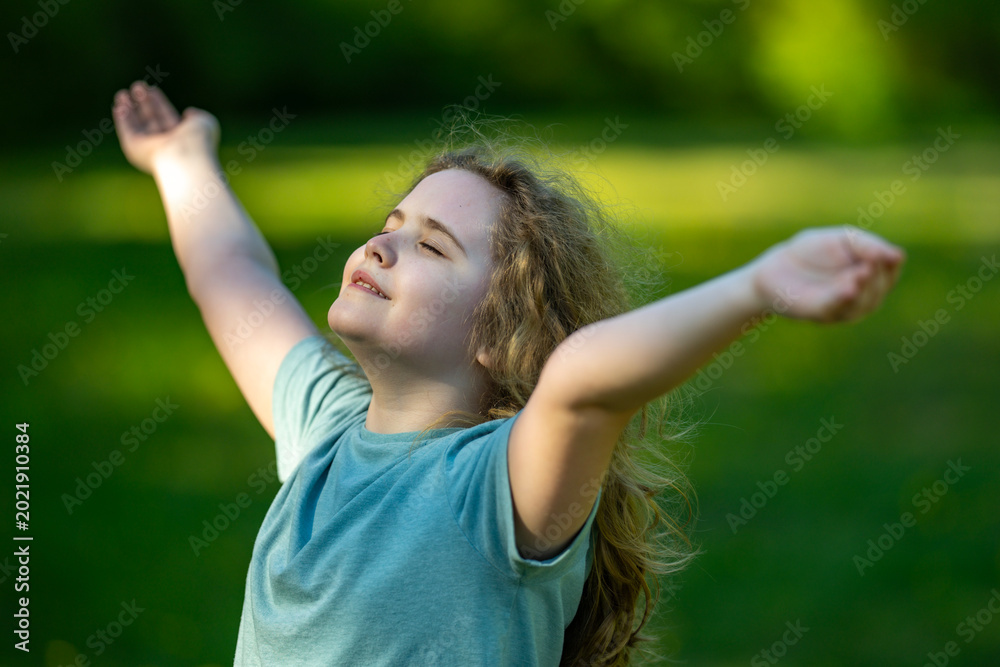 Fototapeta premium Kid open arms support healthy childhood. Kid open arms celebrate playful nature. Happy kid open arms create smiles. Summer kid open arms feel carefree.