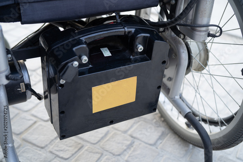 Foto Battery power electric wheelchair increased mobility for disability or elderly patient