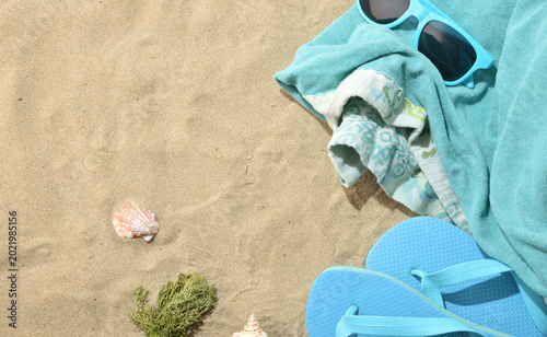 Blue Beach Accessories on Sandy Background
