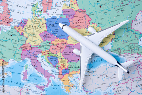 Airplane on Europe map representing international travel and global mobility