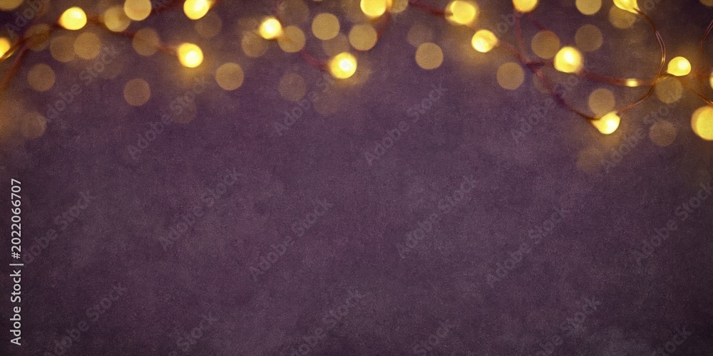 Fototapeta premium Soft Focus Bokeh String Lights on Dark Textured Background with Copy Space