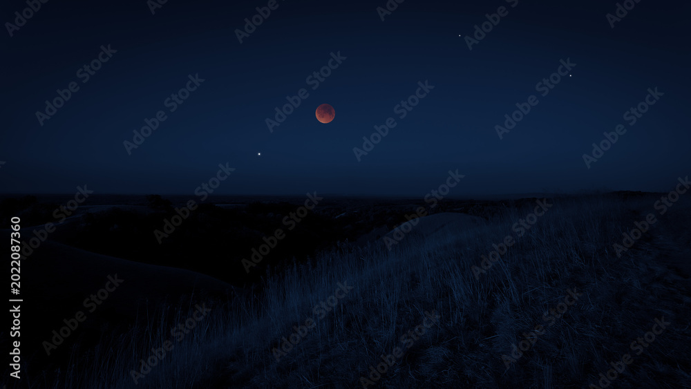 Fototapeta premium Blue hour time with lunar eclipse, stars and planets above landscape silhouettes.