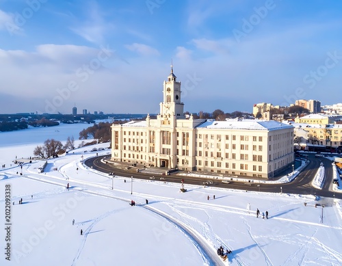 Snowy cityscape with large buildings landscape.