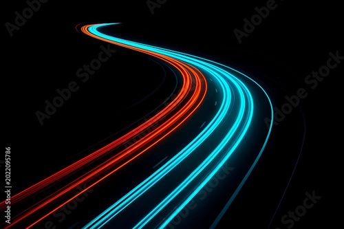 Long Exposure Traffic Light Trails on a Curving Night Highway.