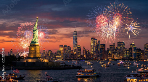 Fireworks Light up the Night Sky Above New York City With the Statue of Liber...