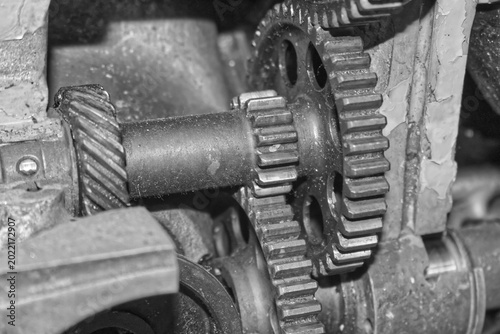 Detailed view of interlocking metal cogs and gears in a mechanical device. Industrial engineering