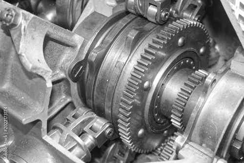 Macro view of double helical herringbone gears. Heavy machinery and industrial technology concept