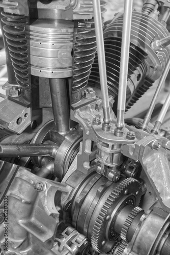 Close-up of complex interlocking metal gears in a heavy industrial engine. Mechanical engineering background