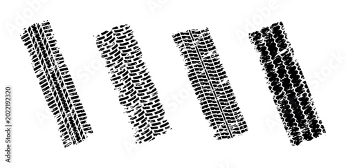 Bild auf Leinwand Collection of four distinct grunge tire tracks on a white background