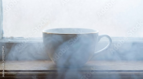Steaming Cup of Coffee by Window