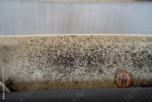 Tableau sur toile Close-up of a dirty surface with mold and grime, conveying neglect and decay