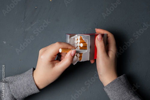Conceptual depiction of cigarette addiction, showing dependency on smoking, highlighting health risks, habitual behavior, withdrawal struggle, and the impact of nicotine on daily life.