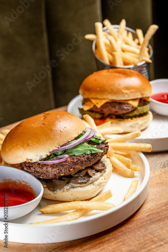 Konstfotografi Burgers and fries on plates