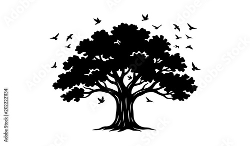 Obraz na płótnie Black silhouette of a majestic oak tree with spreading branches and flying birds