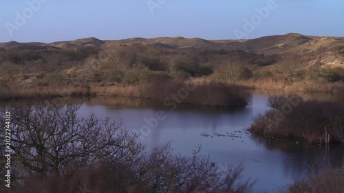 Sand Dunes and Lake at Sunrise in Meijendel Nature Reserve Near The Hague