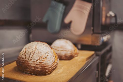 Baking sourdough bread in a kitchen with artisan techniques and healthy ingredients for a flavorful experience