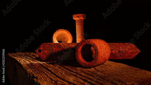 Still life old rusty metal objects on Wood in candle light.