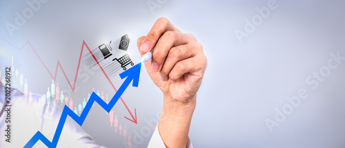 Tableau sur toile Business hand drawing rising market arrow against declining economic chart representing stagflation