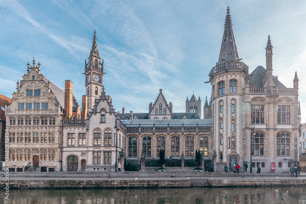 Fototapeta premium Historic canal cityscape in Ghent Belgium on a sunny day